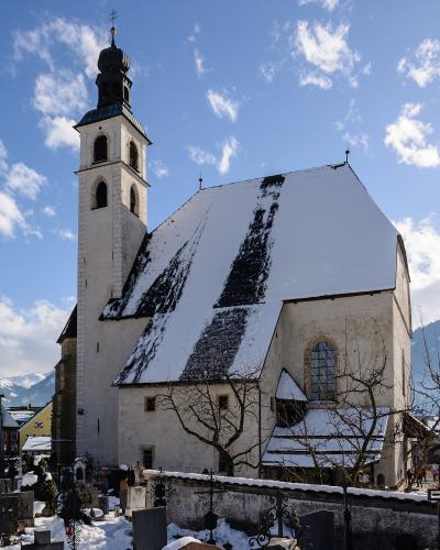 The parish church precinct of Kitzbühel, with St. Michael's chapel, in winter