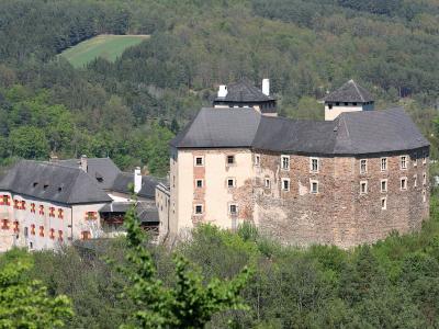 Burg Lockenhaus castle rising above the forested hills of central Burgenland