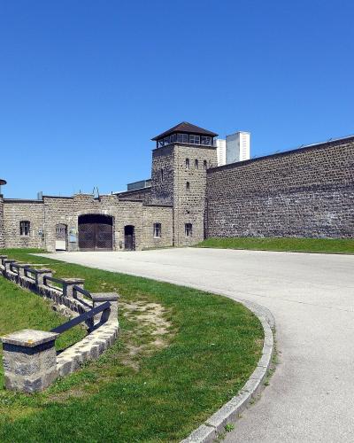 Stone walls and guard towers at the entrance of the Mauthausen Memorial, Upper Austria