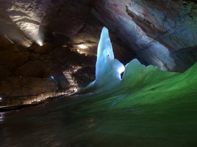 Illuminated ice formations inside the Dachstein Giant Ice Cave near Obertraun