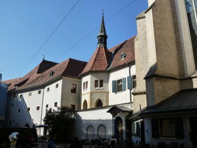 Franciscan Church and monastery with its Gothic tower on Franziskanerplatz in Graz, Austria