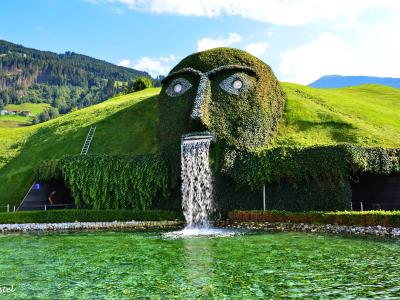 The grass-covered Giant head with waterfall at Swarovski Crystal Worlds in Wattens