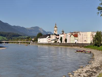 Pastel riverfront houses and church towers of Rattenberg on the Inn river, Tyrol