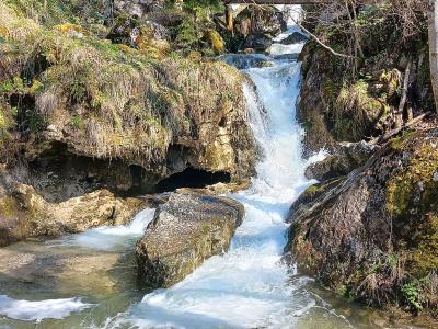 Waterfall cascading over mossy rocks at the Myrafälle in Muggendorf, Lower Austria