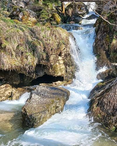 Waterfall cascading over mossy rocks at the Myrafälle in Muggendorf, Lower Austria