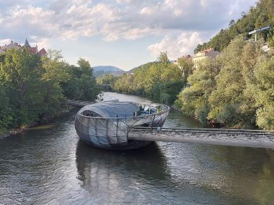 Murinsel, the floating steel shell island by Vito Acconci on the Mur river in Graz