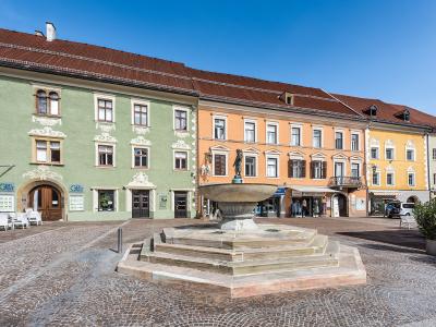 The colourful Hauptplatz of St. Veit an der Glan with its fountain