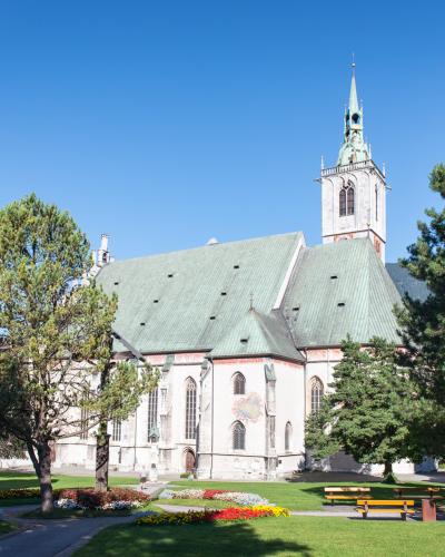 The Gothic parish church of Schwaz with its green roof and tall tower