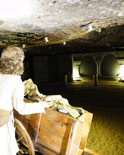 Historic salt-mining scene with figures inside the Salzwelten salt mine at Hallein