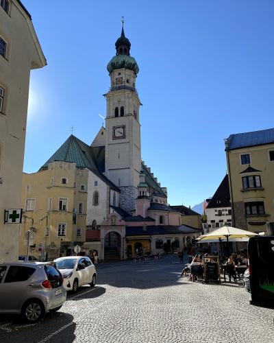 Oberer Stadtplatz in Hall in Tirol old town with the parish church tower