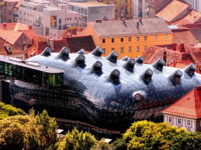 Kunsthaus Graz's blue biomorphic roof amid the red rooftops of Graz's UNESCO-listed Old Town